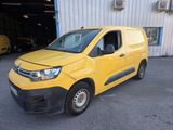 the yellow van is parked in front of a building