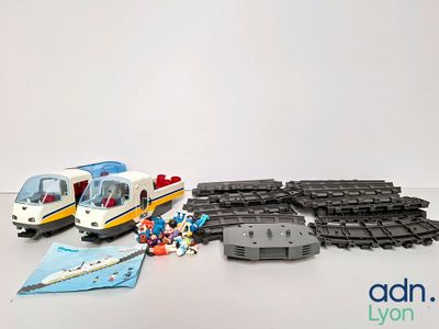 a toy train that is sitting next to some legos