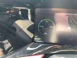 the dashboard of a car with a digital display on it