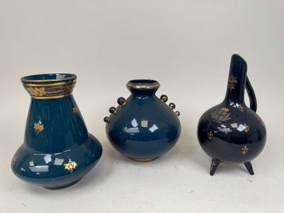 three vases sitting next to each other on a table