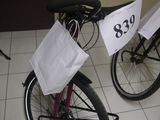 two bikes that have bags attached to them on the back of them