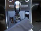 a car dashboard with a phone in the center of it