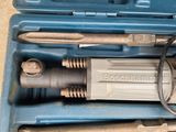 a blue case with tools inside of it on the floor