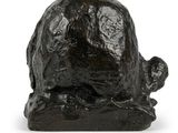 sculpture of a turtle on a rock on a white background