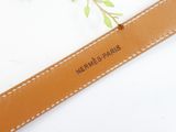 leather belt with the name hermes paris engraved on it
