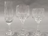 three empty wine glasses sitting next to each other on a table