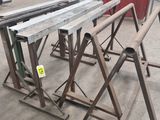 several pieces of metal are stacked on top of each other in a warehouse