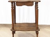 a small wooden table with a drawer on top of it