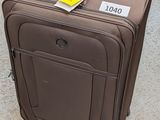 a piece of luggage sitting on the ground with a price tag attached to it
