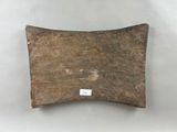 an image of a piece of wood with a tag on it