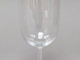 a wine glass that is sitting on a table
