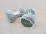 a pair of dumbs wrapped in plastic on the floor