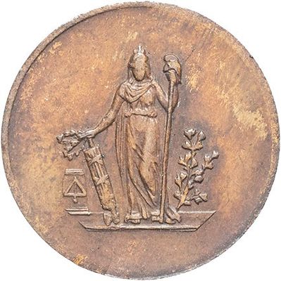 an old coin with a statue of a woman holding a hammer