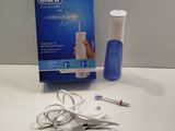 a box of toothpaste and a tooth brush on a table