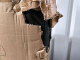 a cardboard box with a hole in it on a table