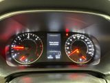 a close up of a car dashboard with various gauges