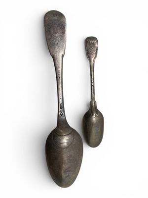 pair of antique spoons on a white background