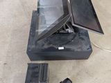 a laptop computer sitting on top of a black box