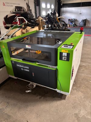 a large machine that is sitting in a garage