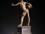 an image of a bronze statue of a man holding a basketball ball