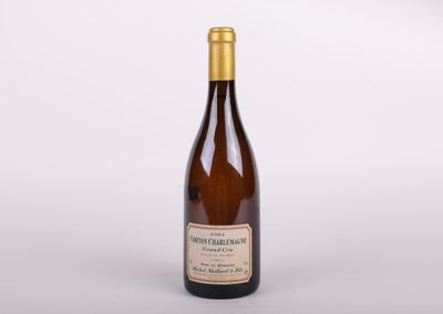 a bottle of wine sitting on top of a white table
