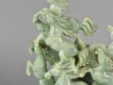chinese celade jade sculpture of four horses and a man on a horse