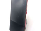a cell phone that is sitting on top of a stand