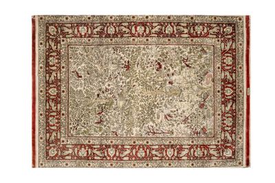 a beige and red rug with a floral design on it