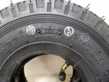 a close up of a tire on a white surface