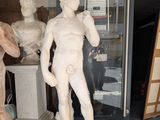 a statue of a man standing next to a statue of a man