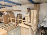 many cardboard boxes stacked on top of each other in a room