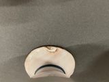 a close up view of a ceiling light with a hole in the ceiling