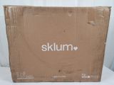 a close up of a cardboard box with a logo on it