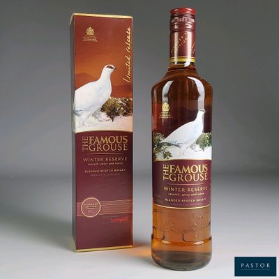 an image of a bottle of whisky sitting next to a box