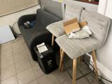 two chairs and a table in the corner of a room