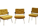 three chairs and a ottoman in a row on a white background