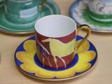 three cups and saucers sitting on a table