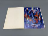 an open book on a table with a painting of a group of people