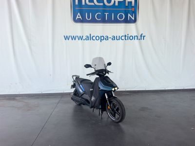 an image of a scooter parked in a showroom