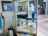 a display case with various items on it in a store
