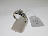 a diamond ring with a price tag attached to it