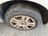 a tire on the side of a car with a flat tire