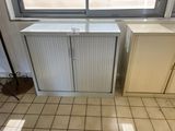 a picture of a kitchen with a white cabinet and a window