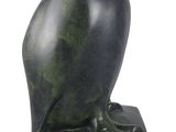 an image of a statue of an owl sitting on top of a base