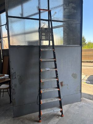 a ladder that is leaning against a wall