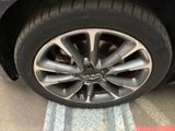 a close up of a tire on a car ' s rim