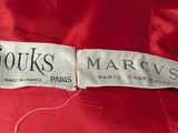 a close up of a label on a red jacket