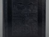 a black book with a picture of a boat in the water