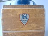 a close up of a wooden box with a logo on it