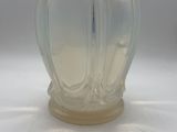 a clear glass vase with a wavy design on it
